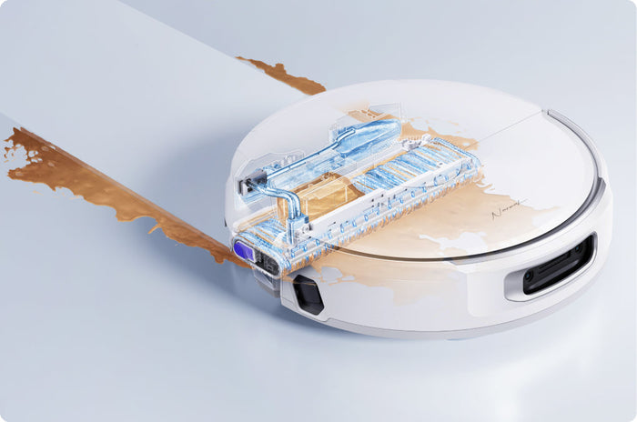 Narwal Flow robot vacuum and mop using its self-cleaning roller system to remove liquid spills from the floor.