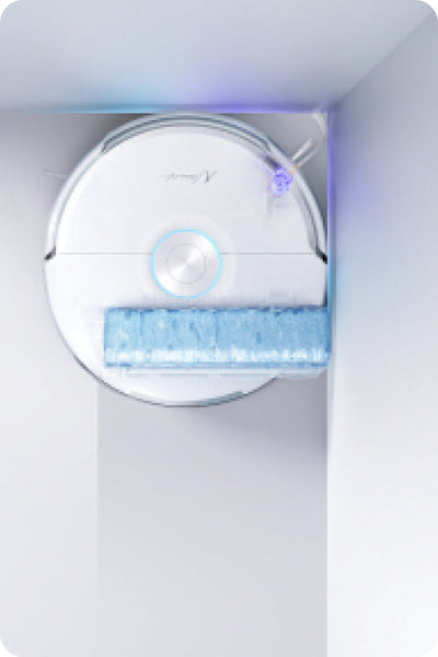 Narwal Flow robot vacuum and mop cleaning deep into a corner with precise edge coverage.